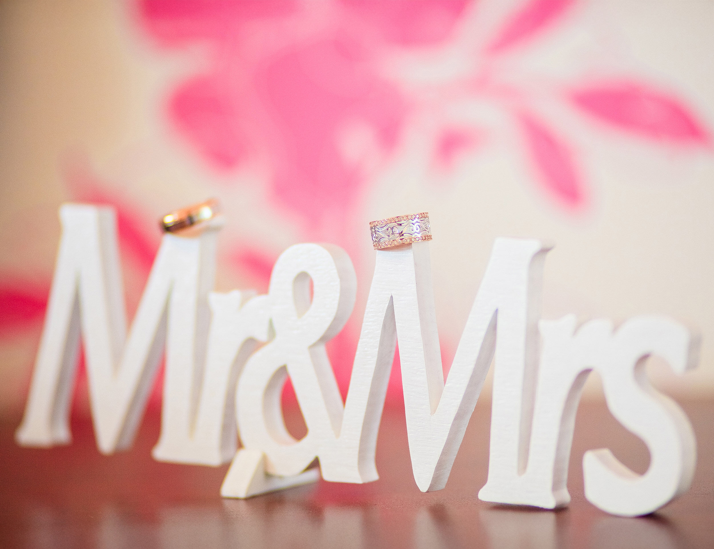 legant 'Mr. and Mrs.' sign featuring wedding rings, perfect for eco-friendly bridal shower decor